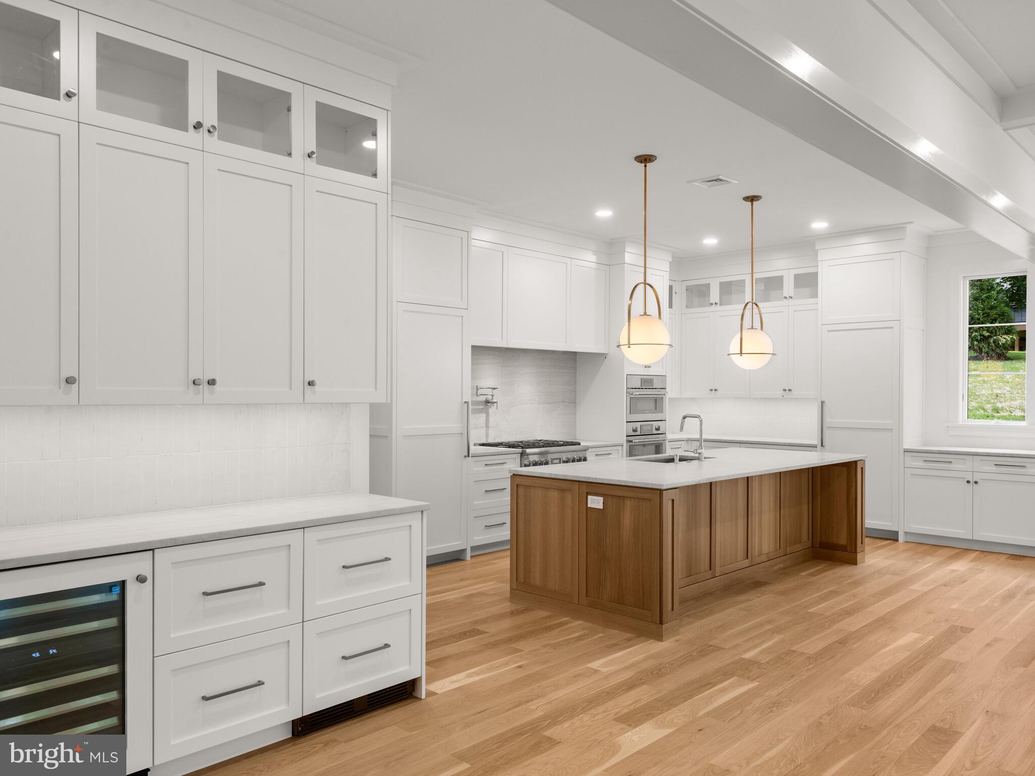 29 Sandringham Road Bala Cynwyd, PA 19004 - Photo 12 of 29 a kitchen with stainless steel appliances granite countertop a sink stove and cabinets