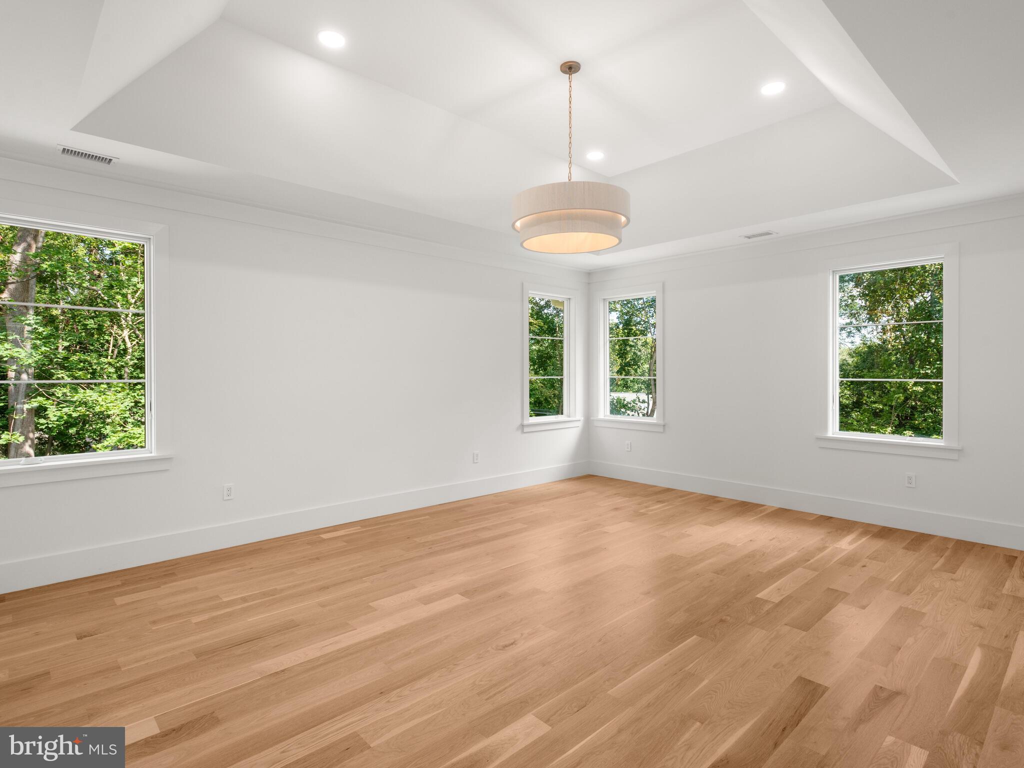 29 Sandringham Road Bala Cynwyd, PA 19004 - Photo 18 of 29 a view of an empty room with wooden floor and a window