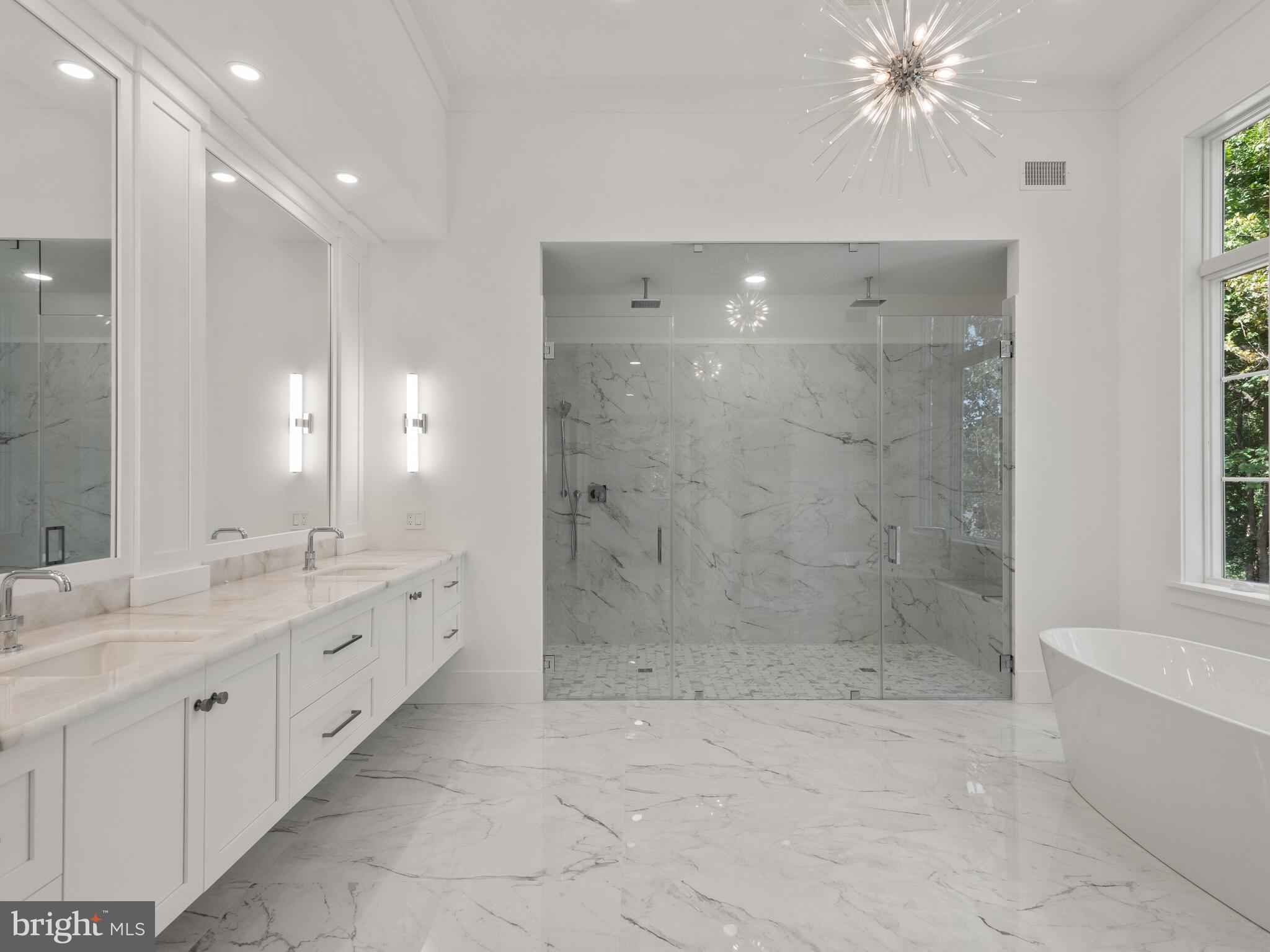 29 Sandringham Road Bala Cynwyd, PA 19004 - Photo 20 of 29 a bathroom with a double vanity sink and a mirror