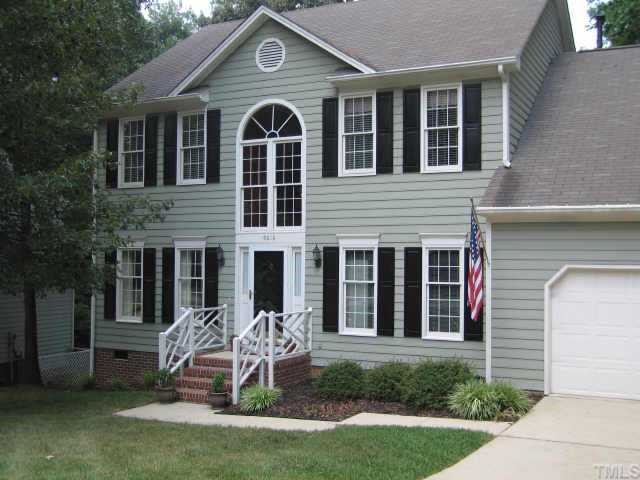 5616 Raddington Street Raleigh, NC 27613 - Photo 1 of 10 a front view of a house with a garden and porch
