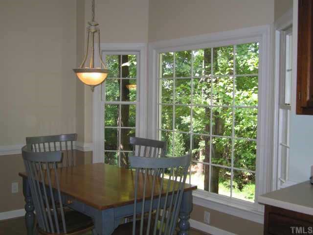 5616 Raddington Street Raleigh, NC 27613 - Photo 4 of 10 a view of a dining room with furniture window and outside view