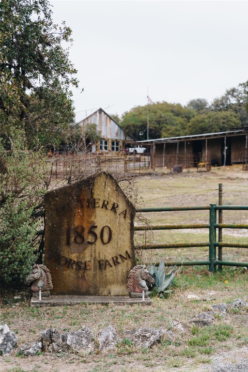 1850 Ranch Road 337 Leakey, TX 78873 - Photo 4 of 31 a view of a wooden house with a yard