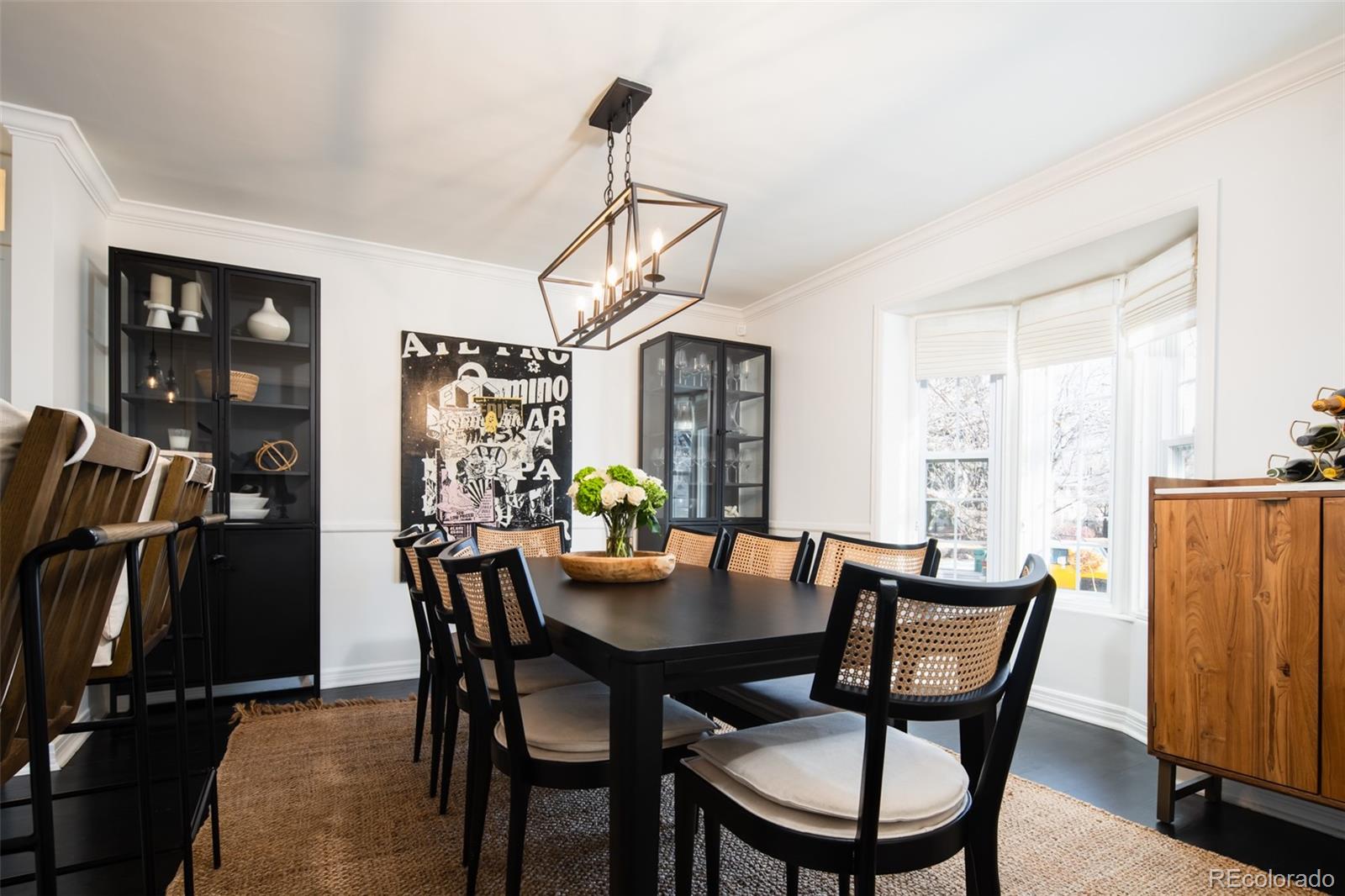 457 Elm Street Denver, CO 80220 - Photo 12 of 45 a dining room with furniture window and wooden floor