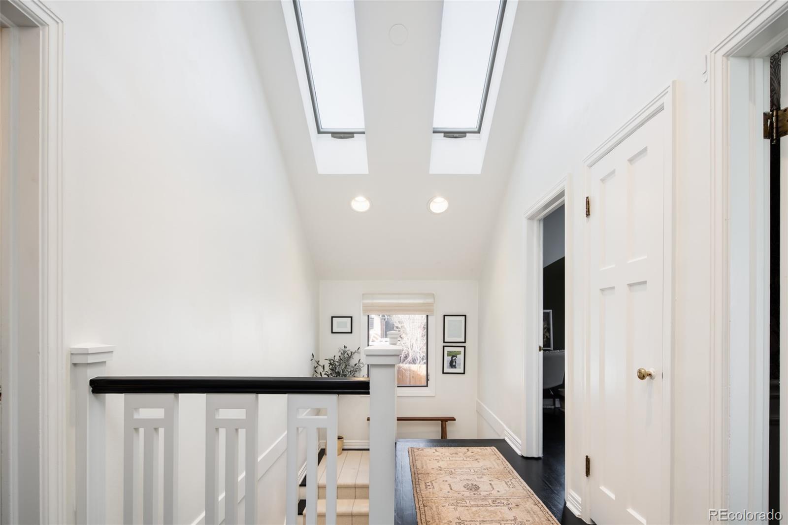 457 Elm Street Denver, CO 80220 - Photo 17 of 45 a view of an entryway with wooden floor