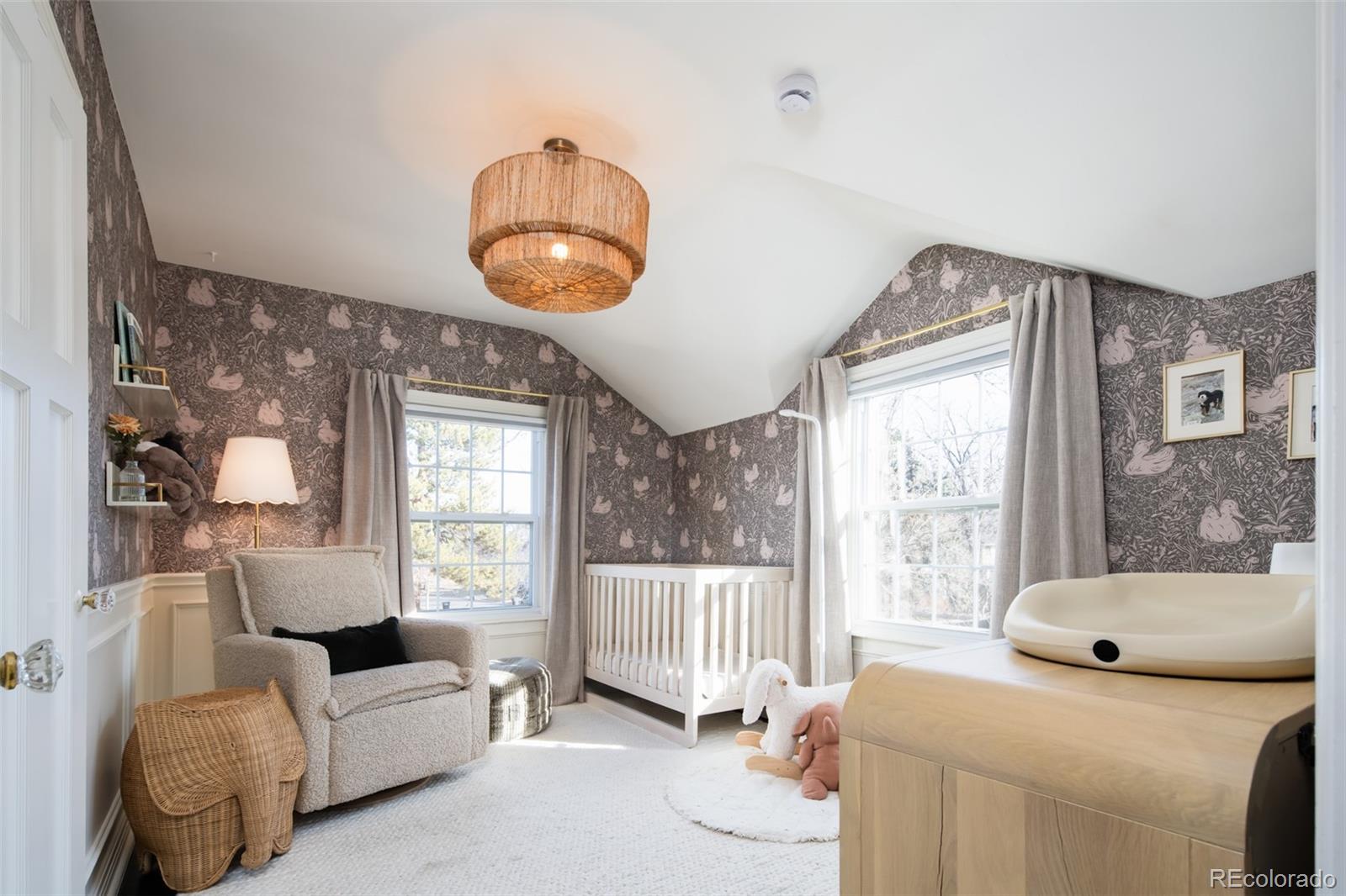 457 Elm Street Denver, CO 80220 - Photo 23 of 45 a living room with furniture and a large window