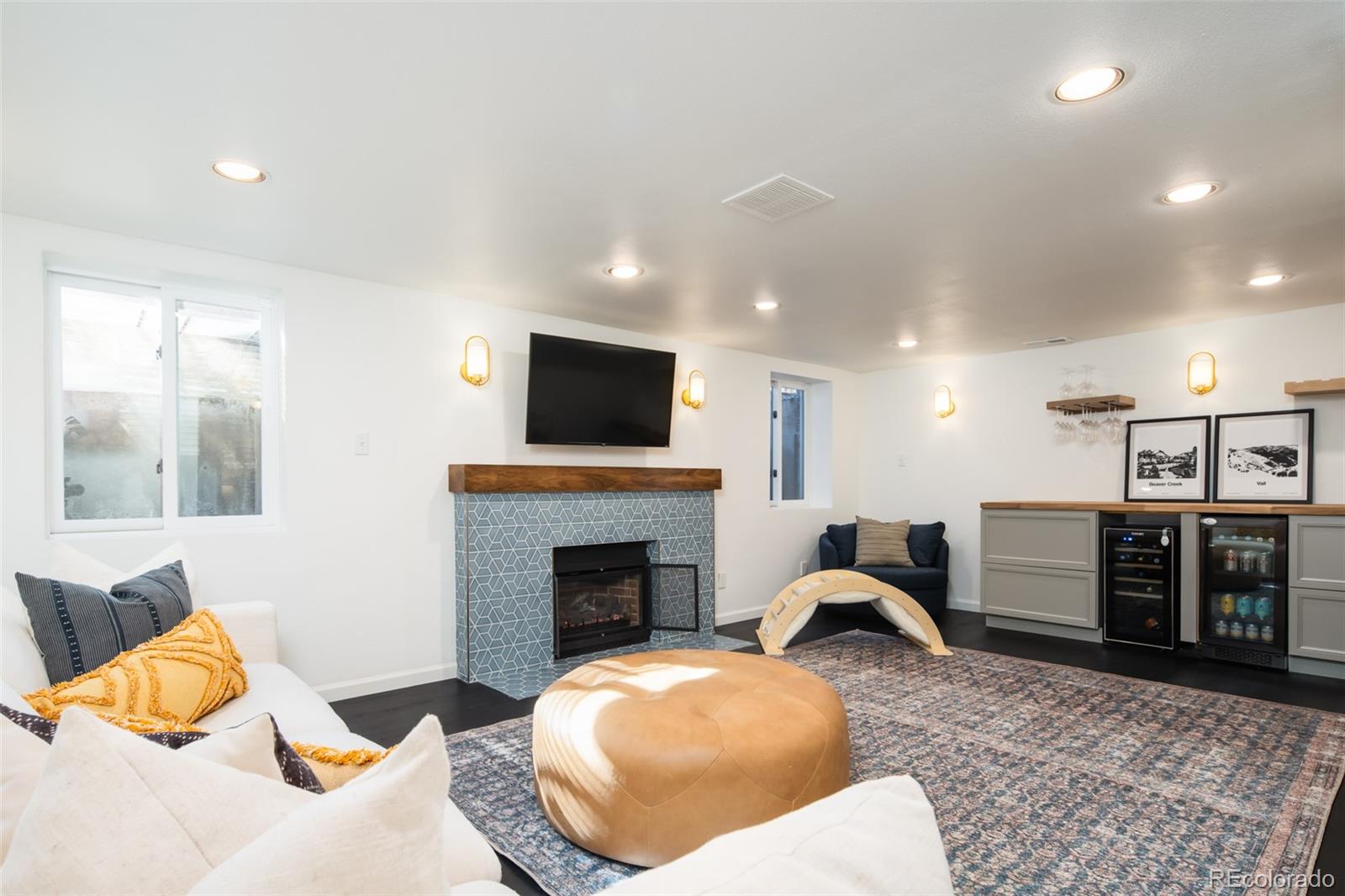 457 Elm Street Denver, CO 80220 - Photo 27 of 45 a living room with furniture and a fireplace