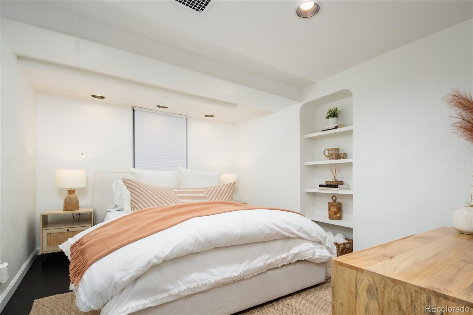 457 Elm Street Denver, CO 80220 - Photo 29 of 45 a bedroom with a bed and a lamp