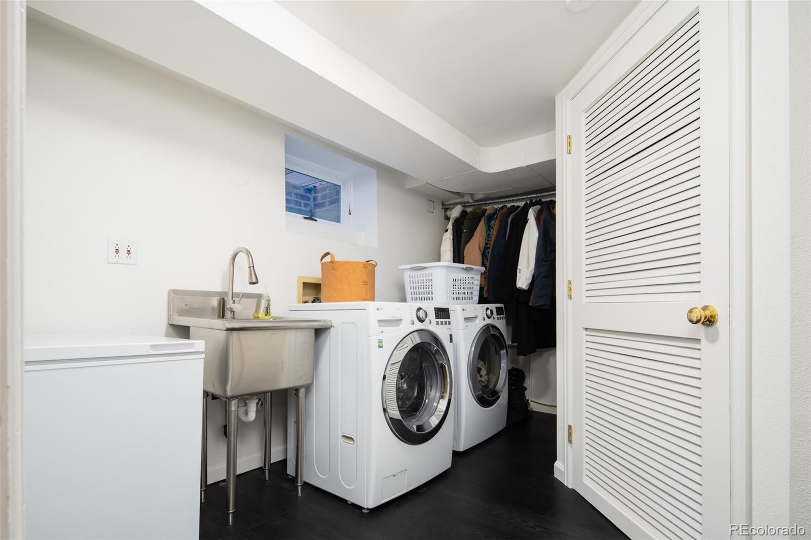 457 Elm Street Denver, CO 80220 - Photo 31 of 45 a utility room with dryer and washer