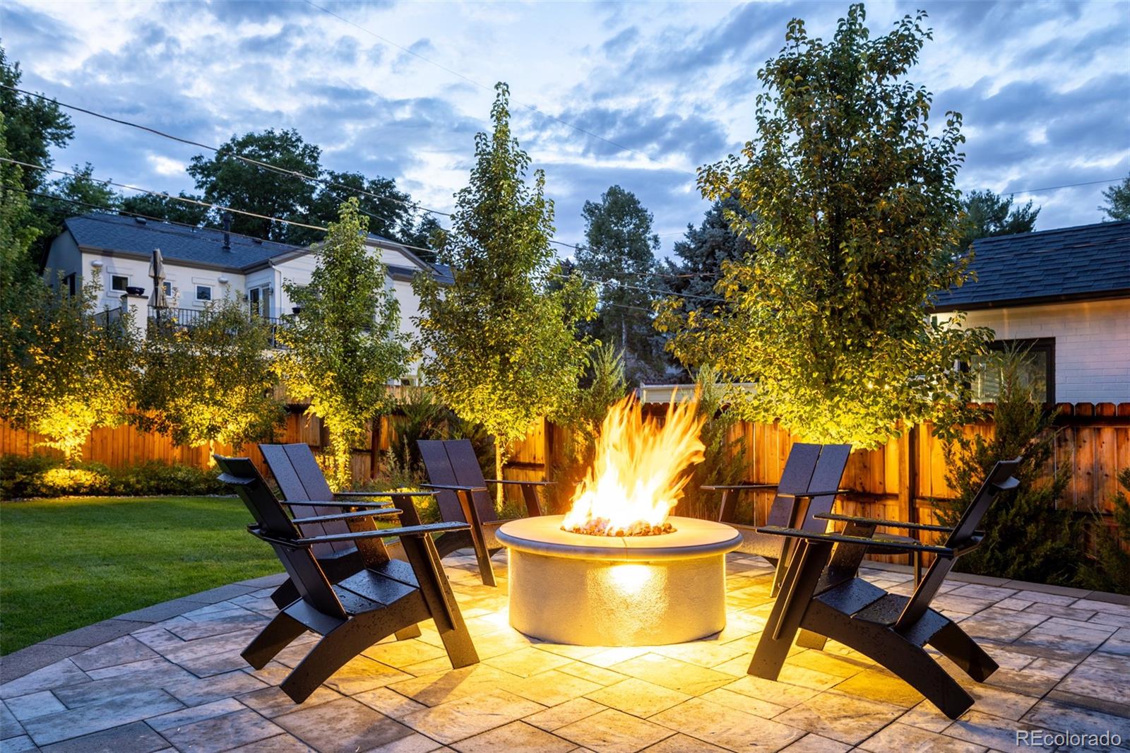 457 Elm Street Denver, CO 80220 - Photo 4 of 45 a backyard of a house with table and chairs