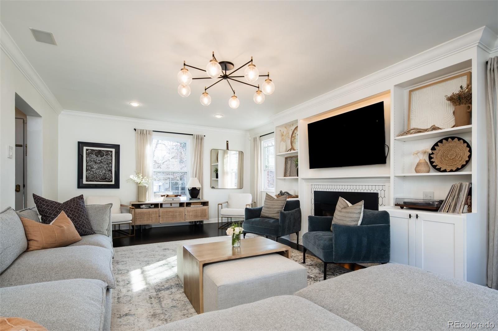 457 Elm Street Denver, CO 80220 - Photo 9 of 45 a living room with furniture and a flat screen tv
