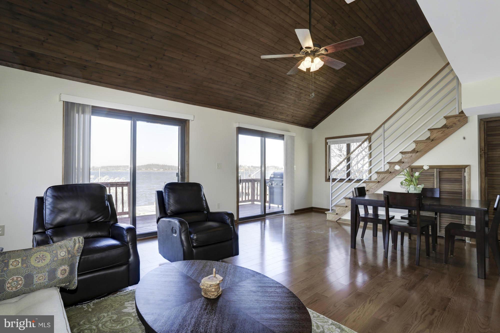 1077 Shore Acres Road Arnold, MD 21012 - Photo 15 of 30 Soaring Living / Dining Room Spilling Out to Deck