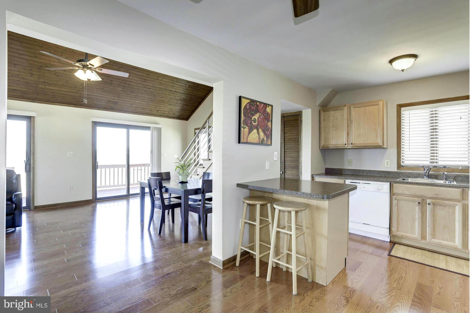 1077 Shore Acres Road Arnold, MD 21012 - Photo 20 of 30 Seamless Flow into Chef's Kitchen with Dining Bar