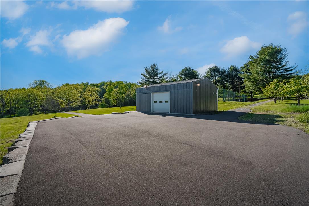 1506 Pleasant View Road Coopersburg, PA 18036 - Photo 93 of 97 A metal outbuilding provides ample storage, complemented by a broad paved driveway.