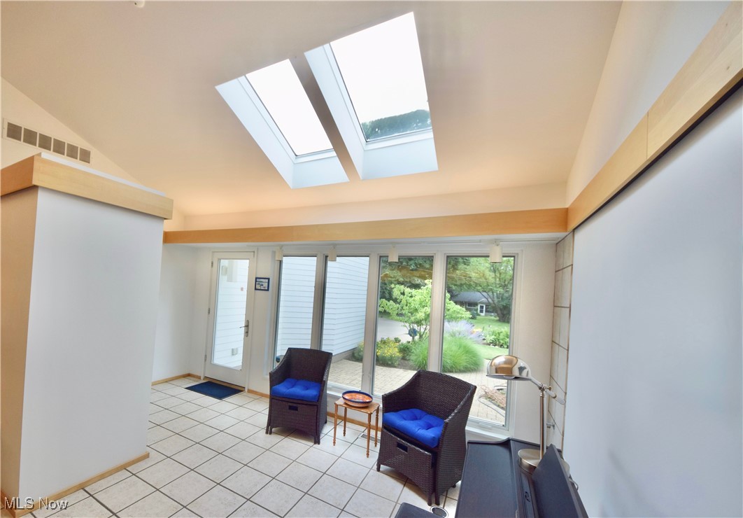 3559 Birchtree Path Cleveland, OH 44121 - Photo 3 of 37 Living area featuring a skylight and light tile patterned floors