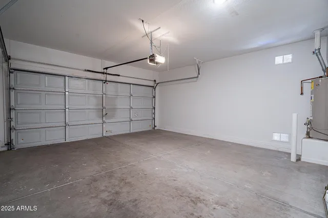a bathroom with a sink vanity mirror and toilet