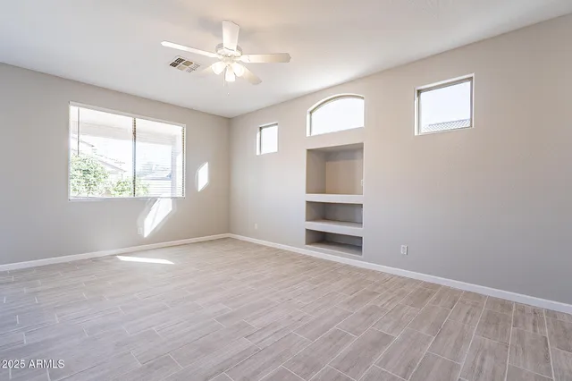 a view of an empty room with a window