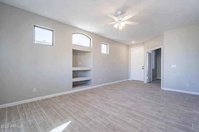a kitchen with stainless steel appliances a kitchen island hardwood floor sink and stove