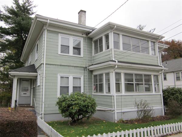 95-97 Warwick Road Newton, MA 02465 - Photo 1 of 1 a front view of a house with a yard