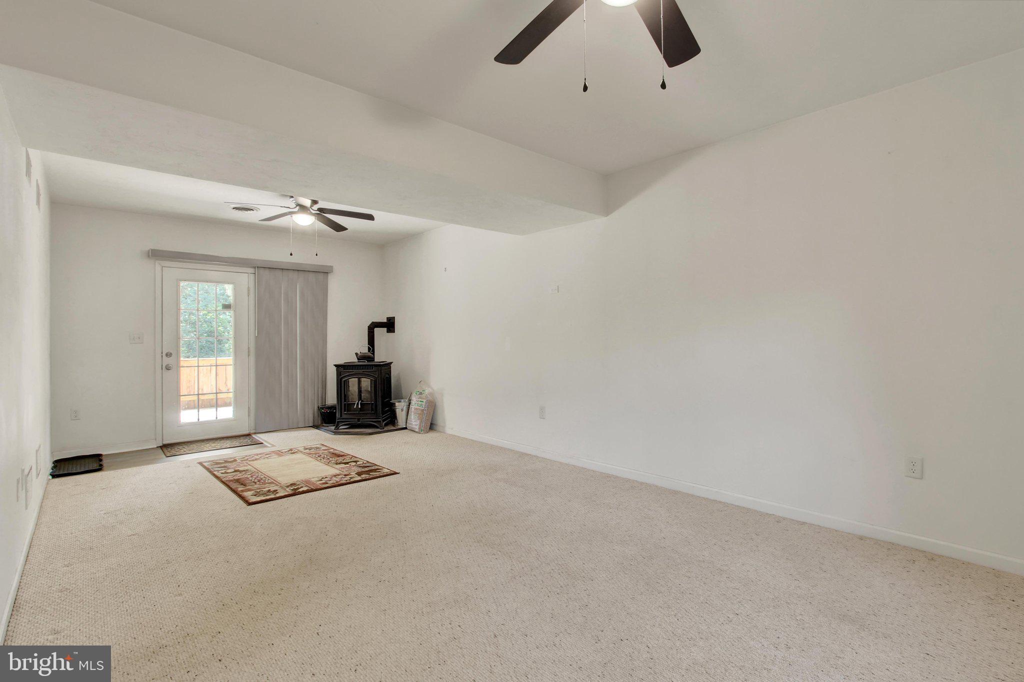 175 Leedy Road Spring Grove, PA 17362 - Photo 23 of 41 Lower level living room with pellet stove