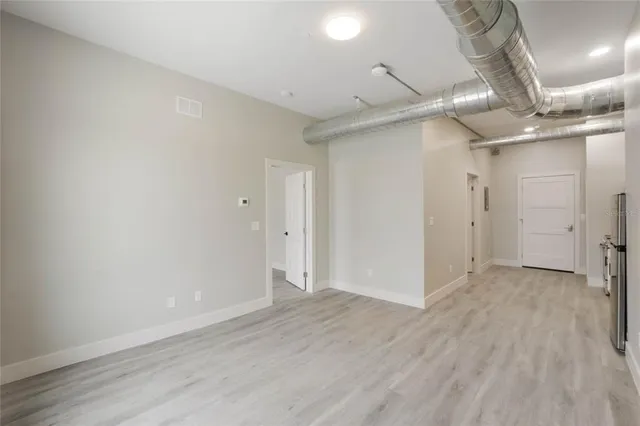 a bathroom with a shower a toilet and a sink