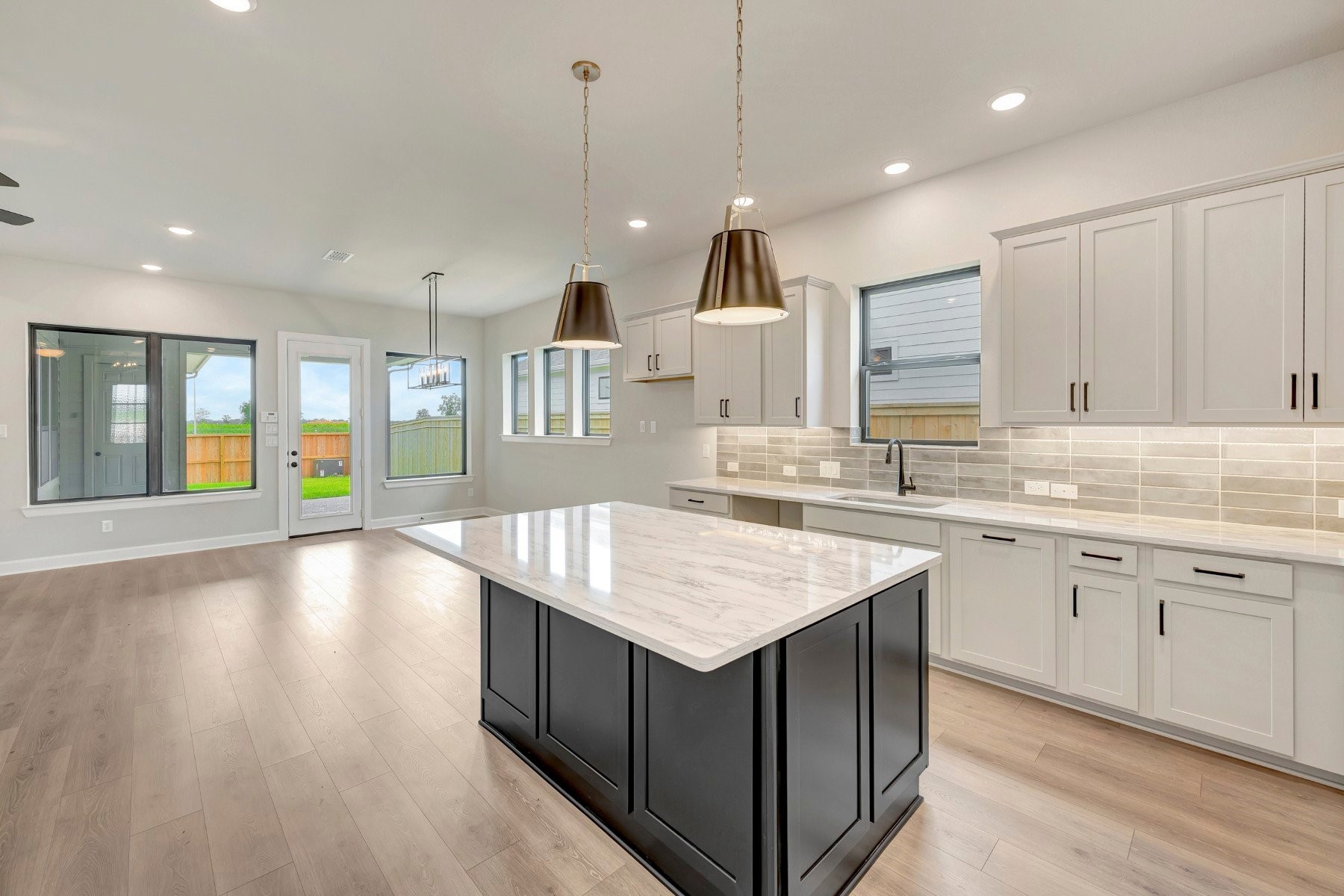 2722 Cottage Place Rosharon, TX 77583 - Photo 22 of 50 an open kitchen with a sink and dish washer