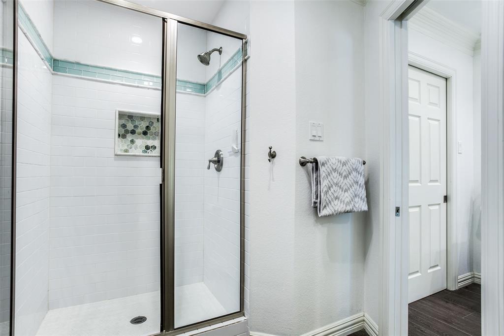 8619 Angora Street Dallas, TX 75218 - Photo 19 of 24 Bathroom featuring wood-type flooring and an enclosed shower
