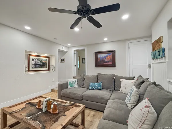 a living room with furniture and a large window