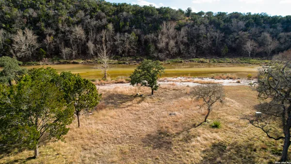 a backyard of a house with large trees