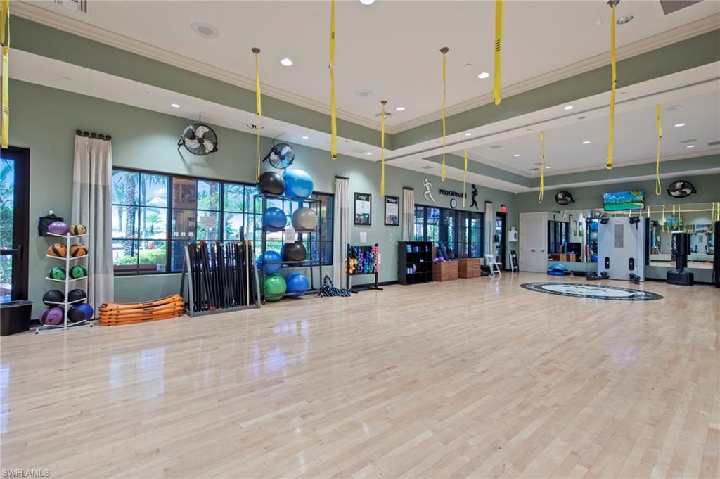 9366 Pocida Court, Unit 202 Naples, FL 34119 - Photo 43 of 44 a view of a room with gym equipment