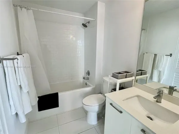 a bathroom with a toilet a sink and a bathtub