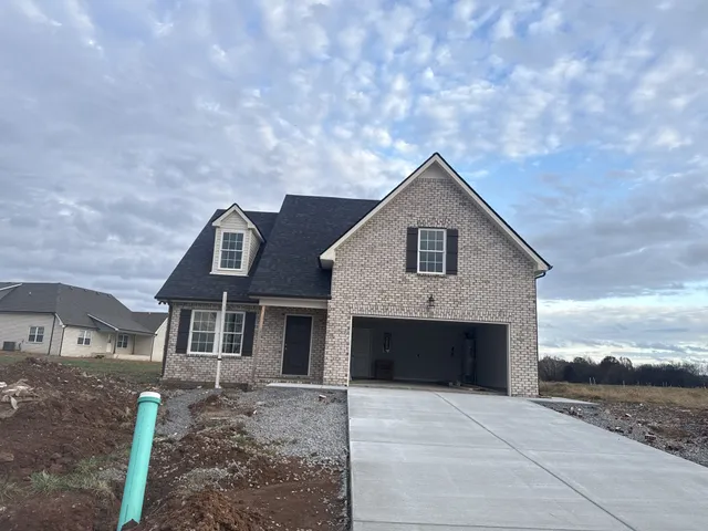 a front view of a house with yard