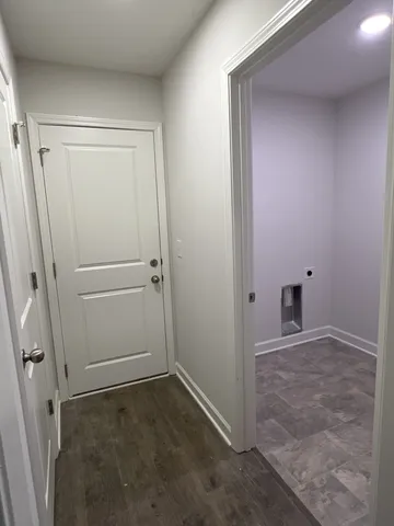 an empty room with a empty space and windows