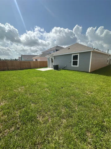a view of a backyard of the house