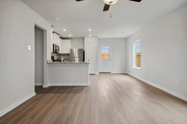 a view of a kitchen with microwave and cabinets