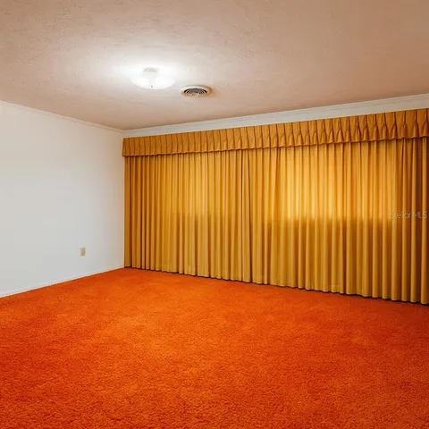 an empty room with an empty space and a window