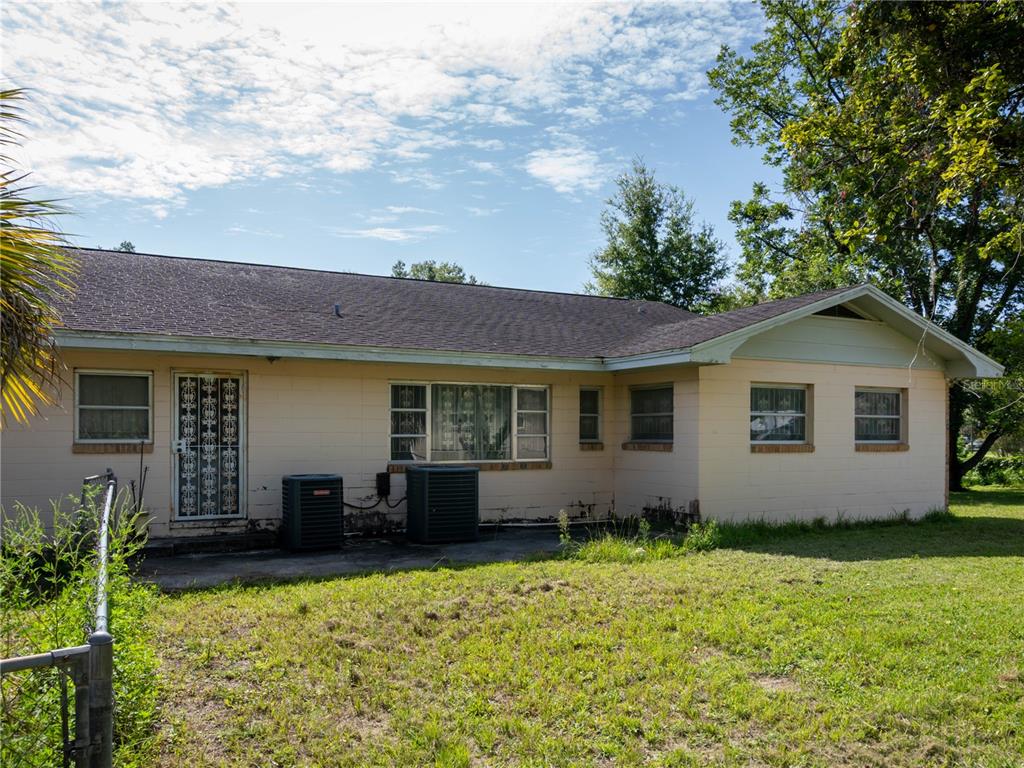 530 Southwest 23rd Avenue Ocala, FL 34471 - Photo 19 of 26 a front view of house with yard and trees in the background