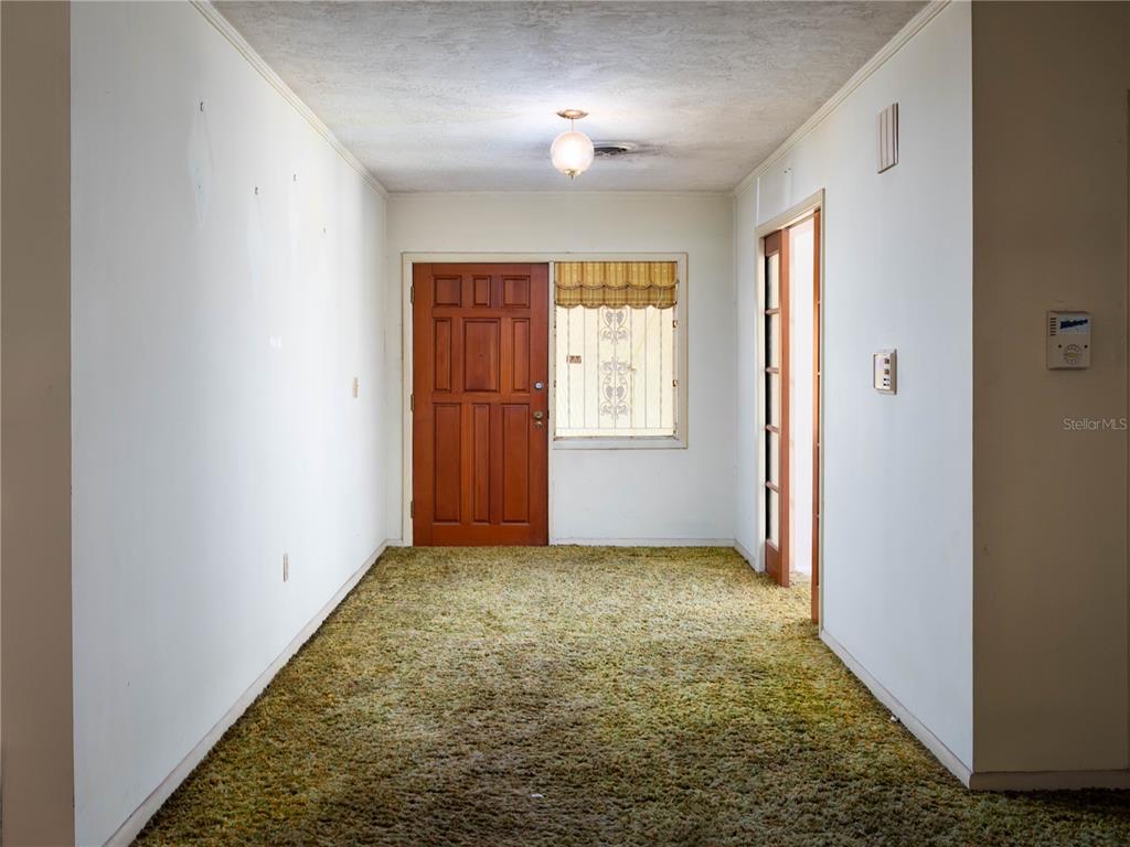 530 Southwest 23rd Avenue Ocala, FL 34471 - Photo 2 of 26 an empty room with windows