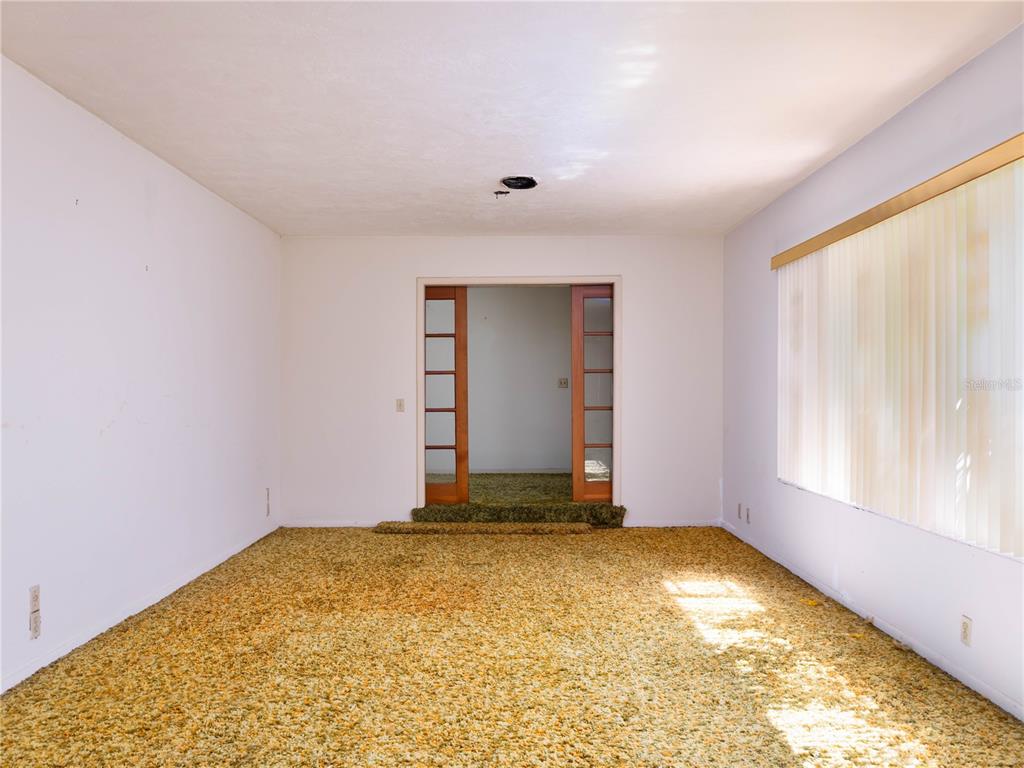530 Southwest 23rd Avenue Ocala, FL 34471 - Photo 4 of 26 an empty room with a window