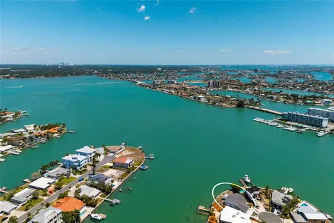 an aerial view of a house with a ocean view