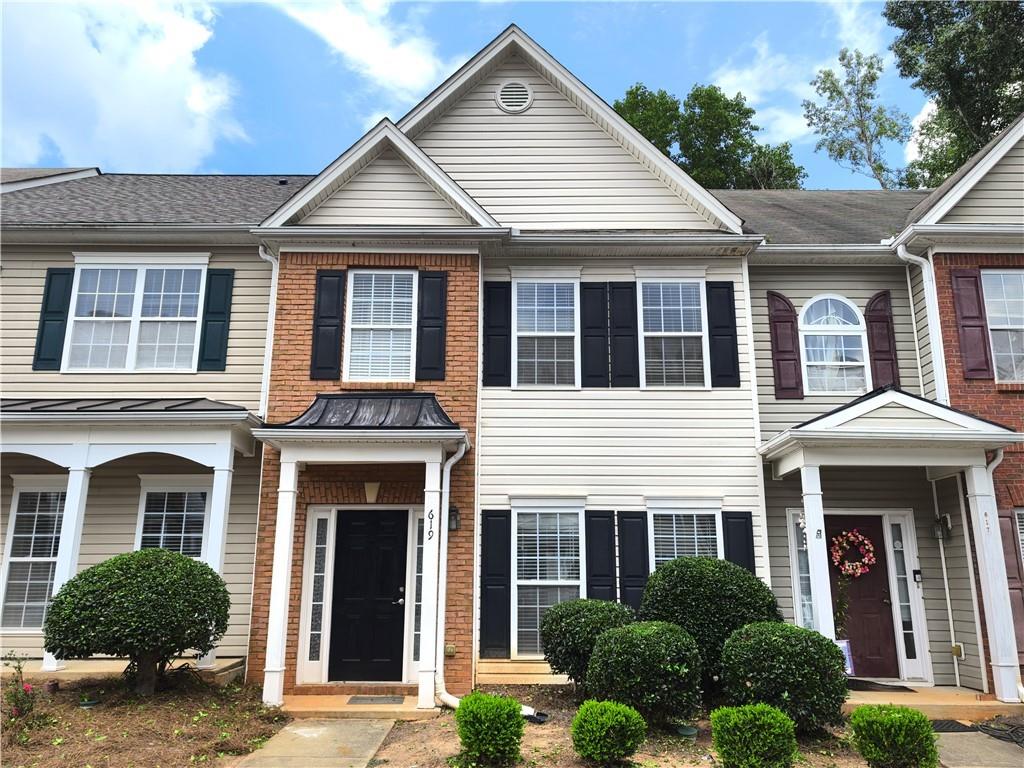 619 Kenridge Way Suwanee, GA 30024 - Photo 1 of 1 a front view of a house