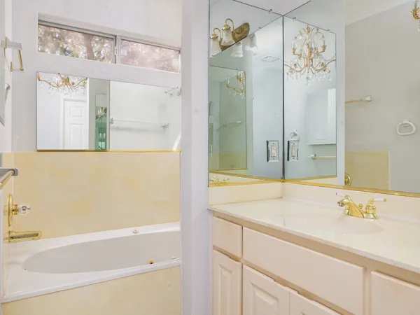 a bathroom with a bathtub and a sink