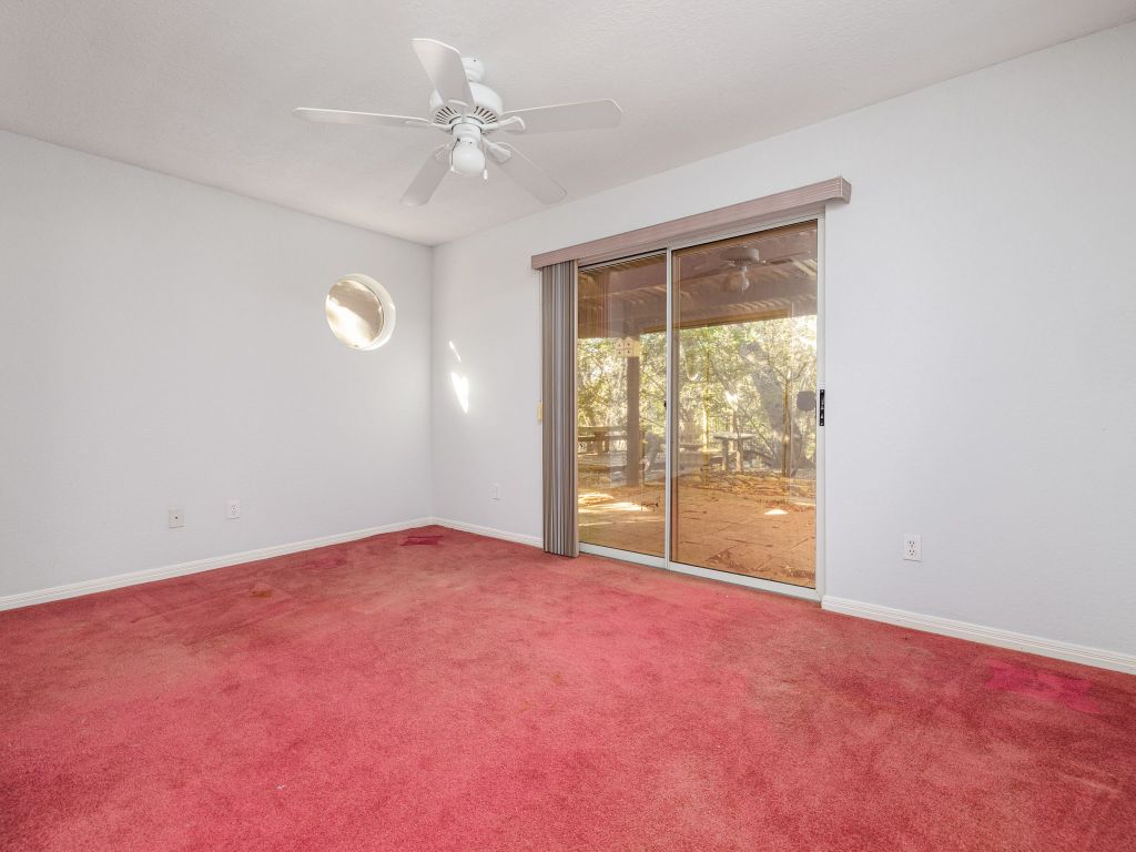 3707 Wyldwood Road Austin, TX 78739 - Photo 11 of 30 an empty room with windows and ceiling fan