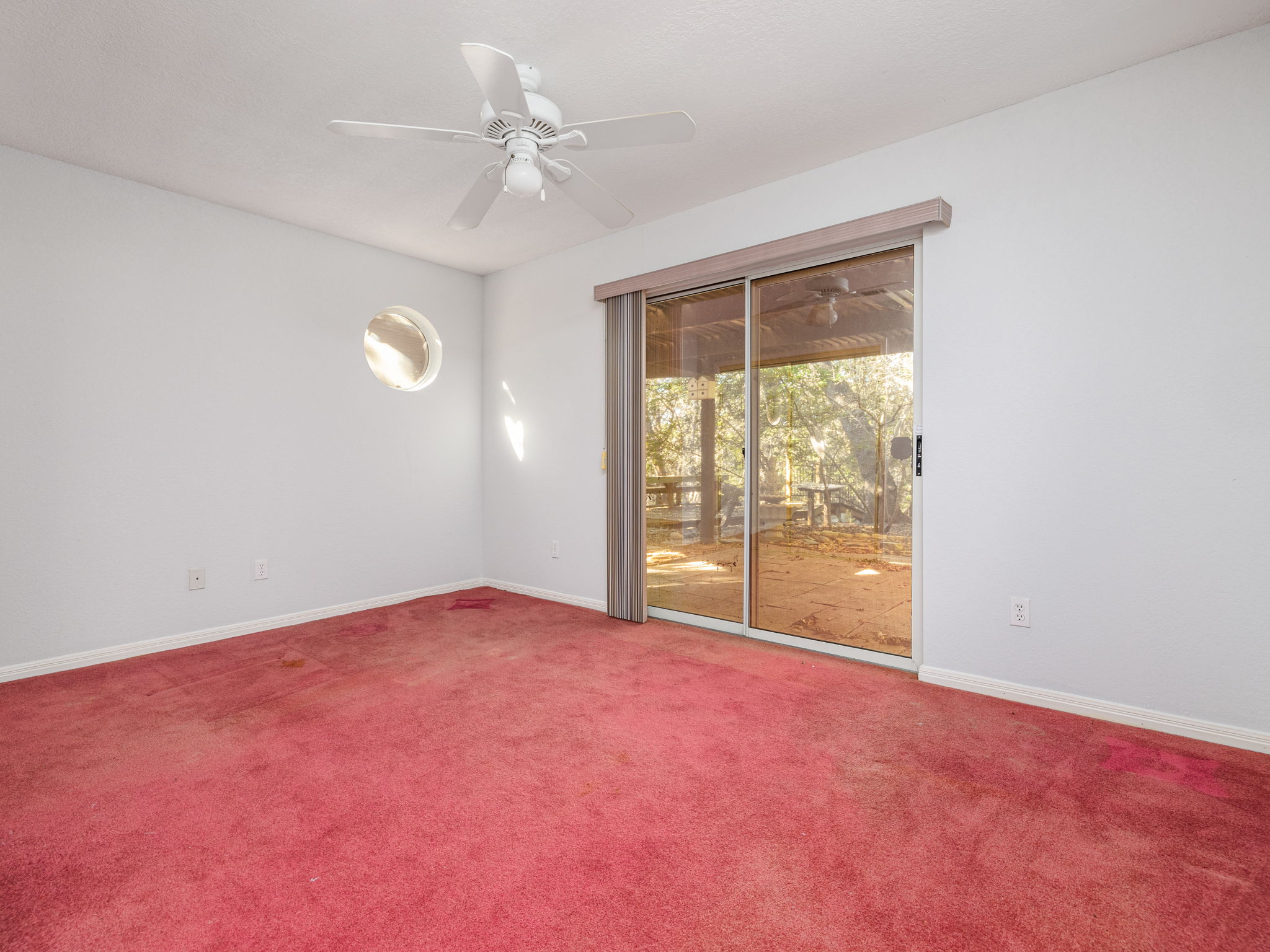 3707 Wyldwood Road Austin, TX 78739 - Photo 11 of 30 an empty room with windows and ceiling fan