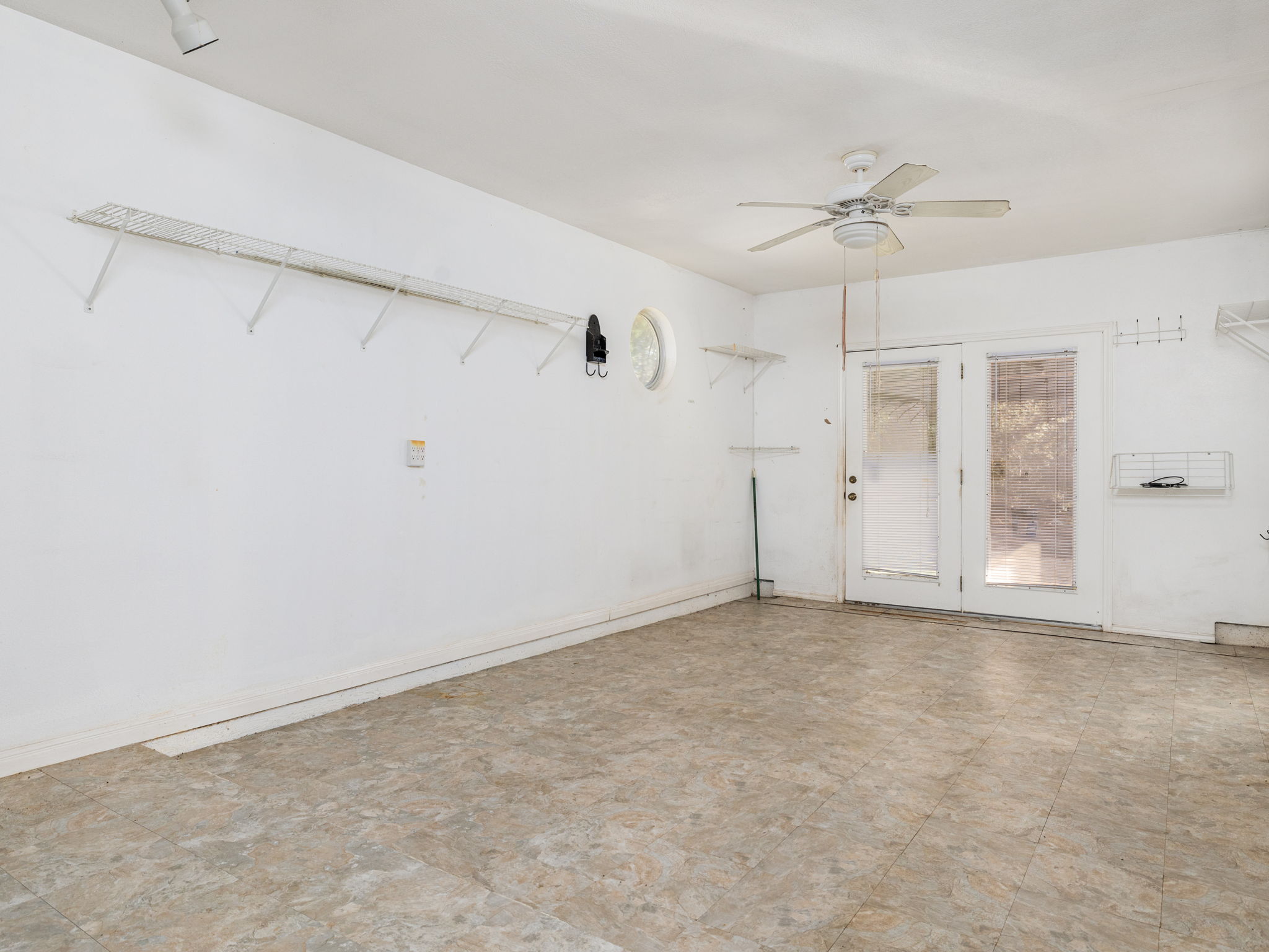 3707 Wyldwood Road Austin, TX 78739 - Photo 14 of 30 Unfurnished room featuring a ceiling fan and light flooring