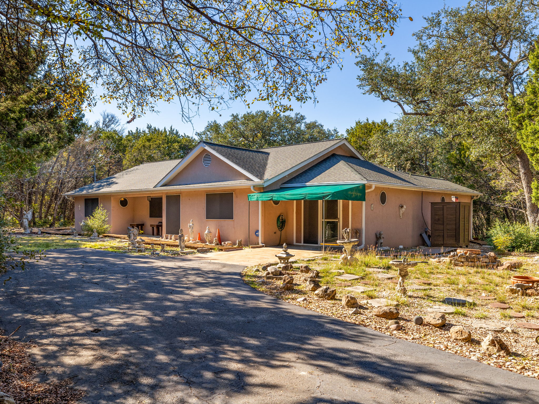 3707 Wyldwood Road Austin, TX 78739 - Photo 2 of 30 a front view of a house with a yard