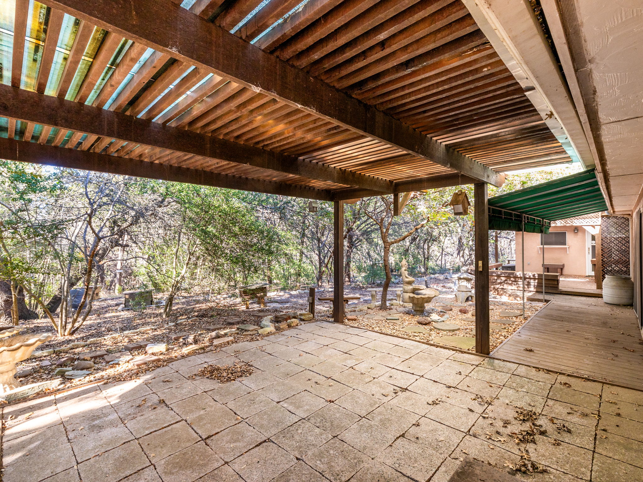 3707 Wyldwood Road Austin, TX 78739 - Photo 21 of 30 a backyard of a house with a large tree