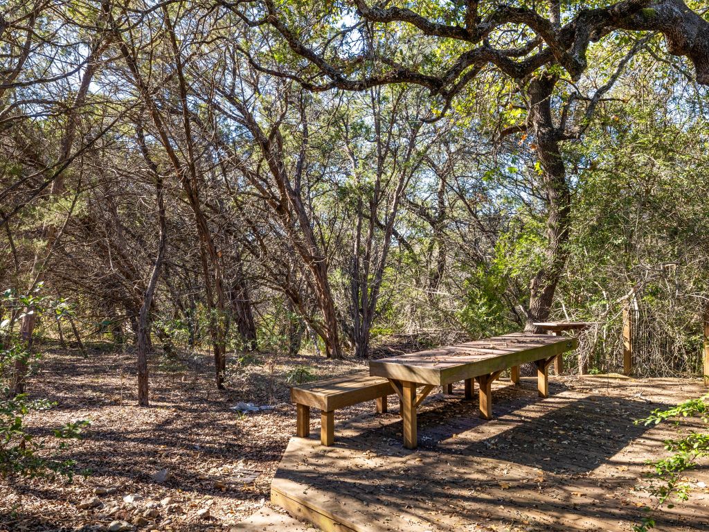 3707 Wyldwood Road Austin, TX 78739 - Photo 25 of 30 a view of a patio with table and chairs under an umbrella