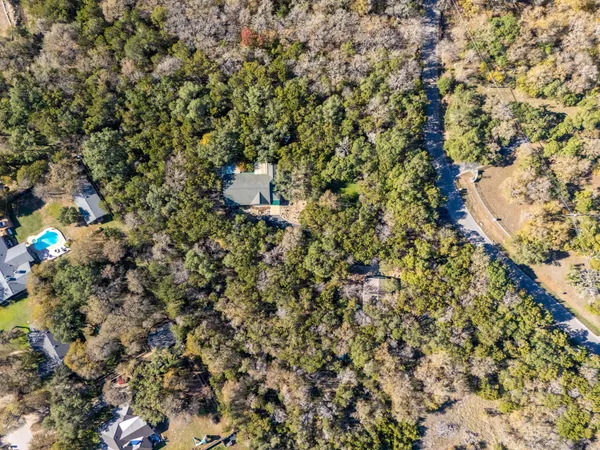 an aerial view of house with yard