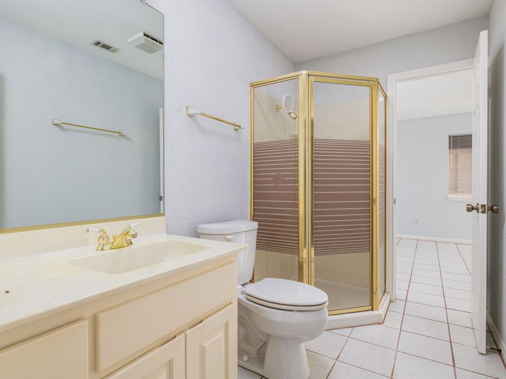 3707 Wyldwood Road Austin, TX 78739 - Photo 8 of 30 a bathroom with a sink a toilet and shower