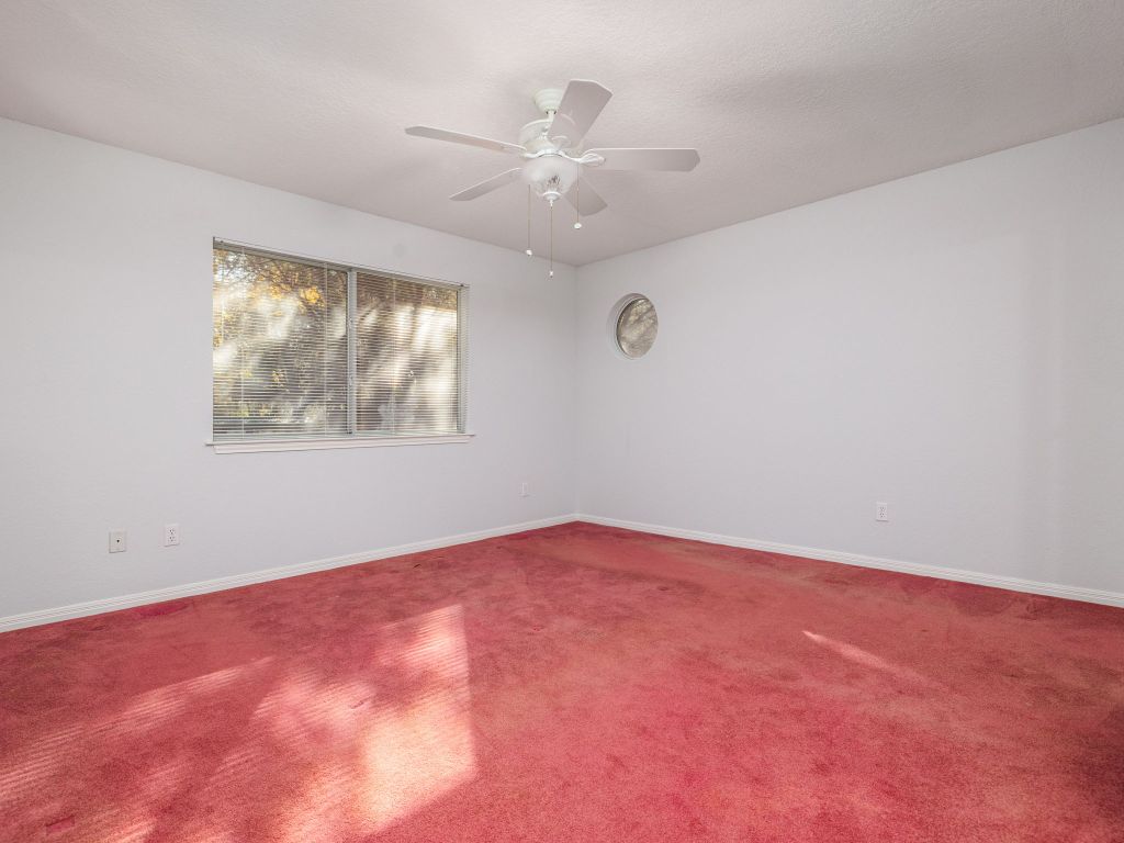 3707 Wyldwood Road Austin, TX 78739 - Photo 9 of 30 an empty room with a window and a ceiling fan